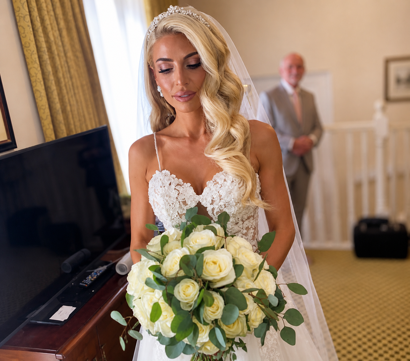 Bride holding a white bouquet after bridal hair and makeup